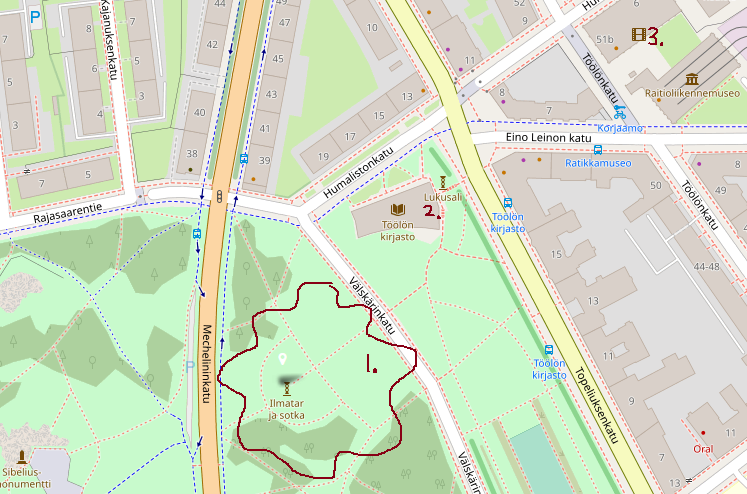 A picture of a map of the area in Töölö surrounding the library. The gathering place near the statue is marked with a wavy line and the number one, while the Töölö library is marked with a number two and Korjaamo with a number three.